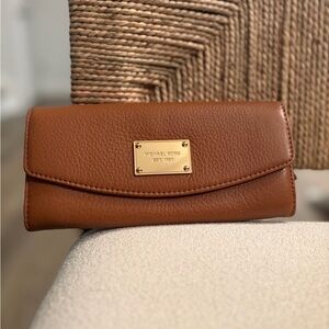 Michael Kors Brown Pebbled Leather Flap Wallet with Gold Plaque